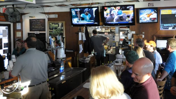 Football on TV at a bar